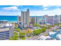 Aerial view of oceanfront resort with pools and beach access at 202 74Th Ave. N # 1249/50, Myrtle Beach, SC 29572