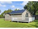 Gray house with a deck and a large backyard at 1210 John St., Mullins, SC 29574