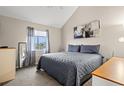 Spacious bedroom with a king-size bed, dresser, and large window at 1851 Colony Dr. # 6J, Myrtle Beach, SC 29575