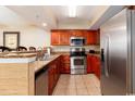 Stainless steel appliances and wood cabinets in kitchen at 1903 S Ocean Blvd. S # 708, North Myrtle Beach, SC 29582