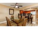 Dining room with glass-top table and wicker chairs at 1903 S Ocean Blvd. S # 708, North Myrtle Beach, SC 29582