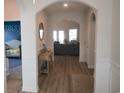 Bright entryway with hardwood floors, leading to living room at 2013 Great Blue Heron Dr., Little River, SC 29566