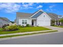 Two-story craftsman style home with two car garage at 2013 Great Blue Heron Dr., Little River, SC 29566