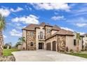 Luxury home with stone and brown roof at 891 Waterton Ave., Myrtle Beach, SC 29579
