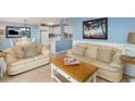 Bright living room features comfortable sofas and coastal decor at 5905 S Kings Highway # 210B, Myrtle Beach, SC 29575