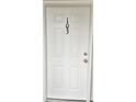 White front door with a black number 103 at 1411 Gooseneck Place # 103, Murrells Inlet, SC 29576