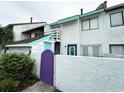 Exterior view of townhome with purple gate and teal accents at 306 21St Ave. S # 4A, Myrtle Beach, SC 29577