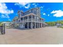 Two-story waterfront home with a large deck and attached garage at 3815 Ed Smith Ave., Myrtle Beach, SC 29588