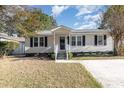 Charming one-story home with light beige siding and black shutters at 838 Marlin Ct., Murrells Inlet, SC 29576