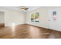 Living room with laminate flooring and large window at 3449 Church St., Loris, SC 29569