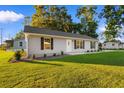 Single story house with gray siding and a front yard at 3449 Church St., Loris, SC 29569