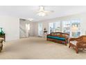 Bright living room with wicker furniture and carpet at 108 Burlington St. W, Holden Beach, NC 28462