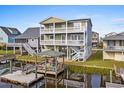 Two-story home with waterfront deck and gazebo at 108 Burlington St. W, Holden Beach, NC 28462