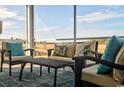 Relaxing screened porch with wicker furniture and a view of the backyard at 1889 Brook Park Pl., Conway, SC 29526