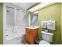 Clean bathroom with tub shower and wood vanity at 2301 Ocean Blvd. S # 1218, Myrtle Beach, SC 29577