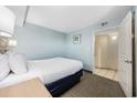 Cozy bedroom with double bed and en-suite bathroom at 2301 Ocean Blvd. S # 1218, Myrtle Beach, SC 29577