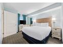 Comfortable bedroom with a king-size bed and a flat-screen TV at 2301 Ocean Blvd. S # 1218, Myrtle Beach, SC 29577