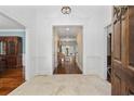Elegant entryway with high ceilings, hardwood floors, and crown molding at 4400 Saint Andrews Ct., Murrells Inlet, SC 29576