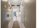 Bright hallway with tile floors and coastal decor at 5905 South Kings Hwy. # A246, Myrtle Beach, SC 29575