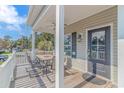 Spacious deck with table and chairs, perfect for outdoor dining at 6001-Mh 32A S Kings Hwy., Myrtle Beach, SC 29575