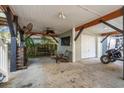 Covered patio with ceiling fan, seating area, and garage access at 6001 - 1870 S Kings Hwy., Myrtle Beach, SC 29575