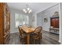 Cozy dining area with a wooden table and chair set at 160 Freeboard Ln. # 802, Carolina Shores, NC 28467