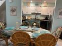 Dining room with wicker chairs and a glass-top table at 9570 Maison Ct., Myrtle Beach, SC 29572