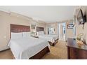 Bright bedroom with two twin beds, nightstands, and ample closet space at 6900 N Ocean Blvd. N # 1238, Myrtle Beach, SC 29572