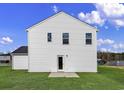 Rear view of a two-story house, featuring vinyl siding and a private backyard at 1053 Kinness Dr., Conway, SC 29527