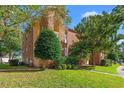 Side view of a brick apartment building with landscaping at 4273 Villas Dr. # 1007, Little River, SC 29566