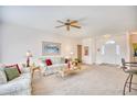 Spacious living room with light colored sofa and access to kitchen and entry at 812 Lalton Dr., Conway, SC 29526