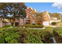 Brick house with landscaped yard and two-car garage at 505 Quincy Hall Dr., Myrtle Beach, SC 29579