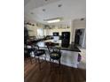 Open kitchen boasts granite counters and breakfast bar at 1538 Lanterns Rest Rd. # 303, Myrtle Beach, SC 29579
