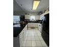 Modern kitchen with granite countertops and black appliances at 1538 Lanterns Rest Rd. # 303, Myrtle Beach, SC 29579