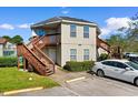 Two-story building with wooden stairs and parking at 409A Tree Top Ct. # 409A, Myrtle Beach, SC 29588