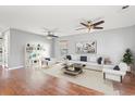 Spacious living room with hardwood floors, two ceiling fans, and a neutral color palette at 2248 Beauclair Ct., Myrtle Beach, SC 29579