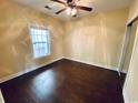 Bedroom with large window and ceiling fan at 4819 Orchid Way # 104, Myrtle Beach, SC 29577