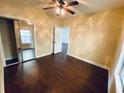 Bright bedroom with mirrored closet and ceiling fan at 4819 Orchid Way # 104, Myrtle Beach, SC 29577