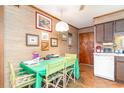 Small kitchen with wood cabinets and a dining area at 1582 S Waccamaw Dr. # 60, Garden City Beach, SC 29576