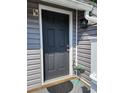 Dark gray front door with a crane statue at 421 Cambridge Circle # F8, Murrells Inlet, SC 29576