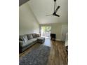 Spacious living room with L-shaped sofa and access to balcony at 421 Cambridge Circle # F8, Murrells Inlet, SC 29576