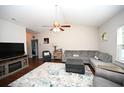 Living room with hardwood floors and a cozy seating area at 378 Oak Crest Circle, Longs, SC 29568