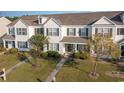 Aerial view of charming townhome community, showcasing manicured lawns and landscaping at 893 Barn Owl Ct. # 893, Myrtle Beach, SC 29579