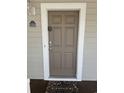 Simple brown door with white frame and welcome mat at 5801 Oyster Catcher Dr. # 1531, North Myrtle Beach, SC 29582