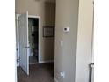 Small bathroom with toilet and vanity, accessible through hallway at 5801 Oyster Catcher Dr. # 1531, North Myrtle Beach, SC 29582