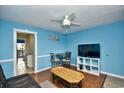 Living room features a flat-screen TV and casual dining area at 120 North Dogwood Dr. # 113, Garden City Beach, SC 29576