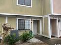 Townhome entrance with landscaping and parking at 1210 Pinegrove Dr. # G, Myrtle Beach, SC 29577