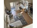 Spacious living room with L-shaped sofa and balcony access at 501 Maison Dr. # G15, Myrtle Beach, SC 29572