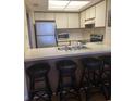 Kitchen with breakfast bar and appliances at 501 Maison Dr. # G15, Myrtle Beach, SC 29572