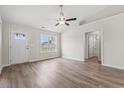 Spacious living room with vinyl plank flooring and a ceiling fan at 326 Barn Owl Way, Conway, SC 29527